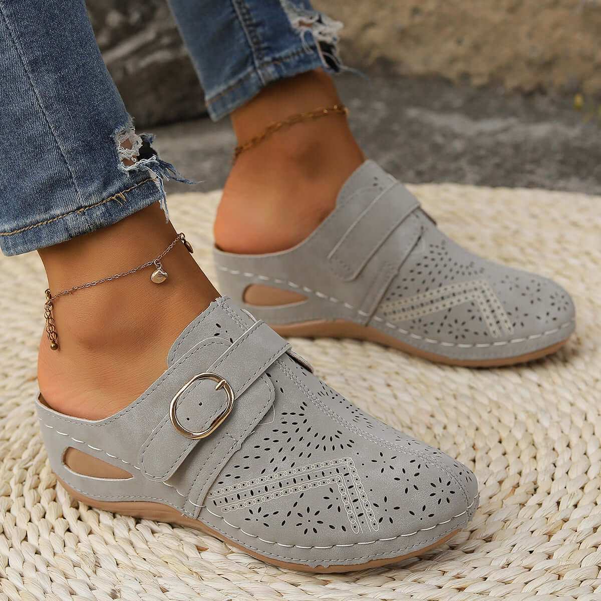 Suede Round Toe Wedge Sandals with mid heels and buckle detail.