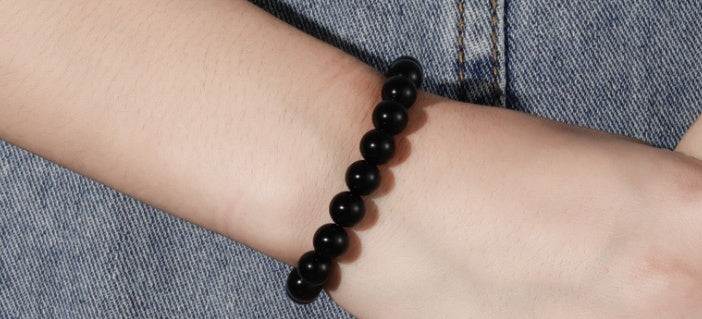 Black Onyx Bracelet with 8MM geometric black agate beads on wrist.