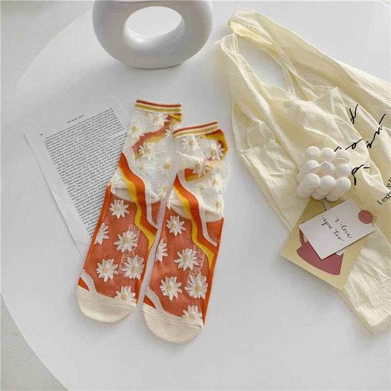 Retro Personality Breathable Glass Silk Bright Color Socks with floral pattern on a table.