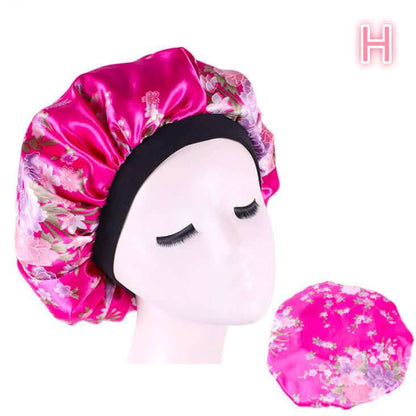 Beauty print Satin silk Bonnet sleep night cap in vibrant pink with floral design, ideal for protecting hair and enhancing beauty sleep.