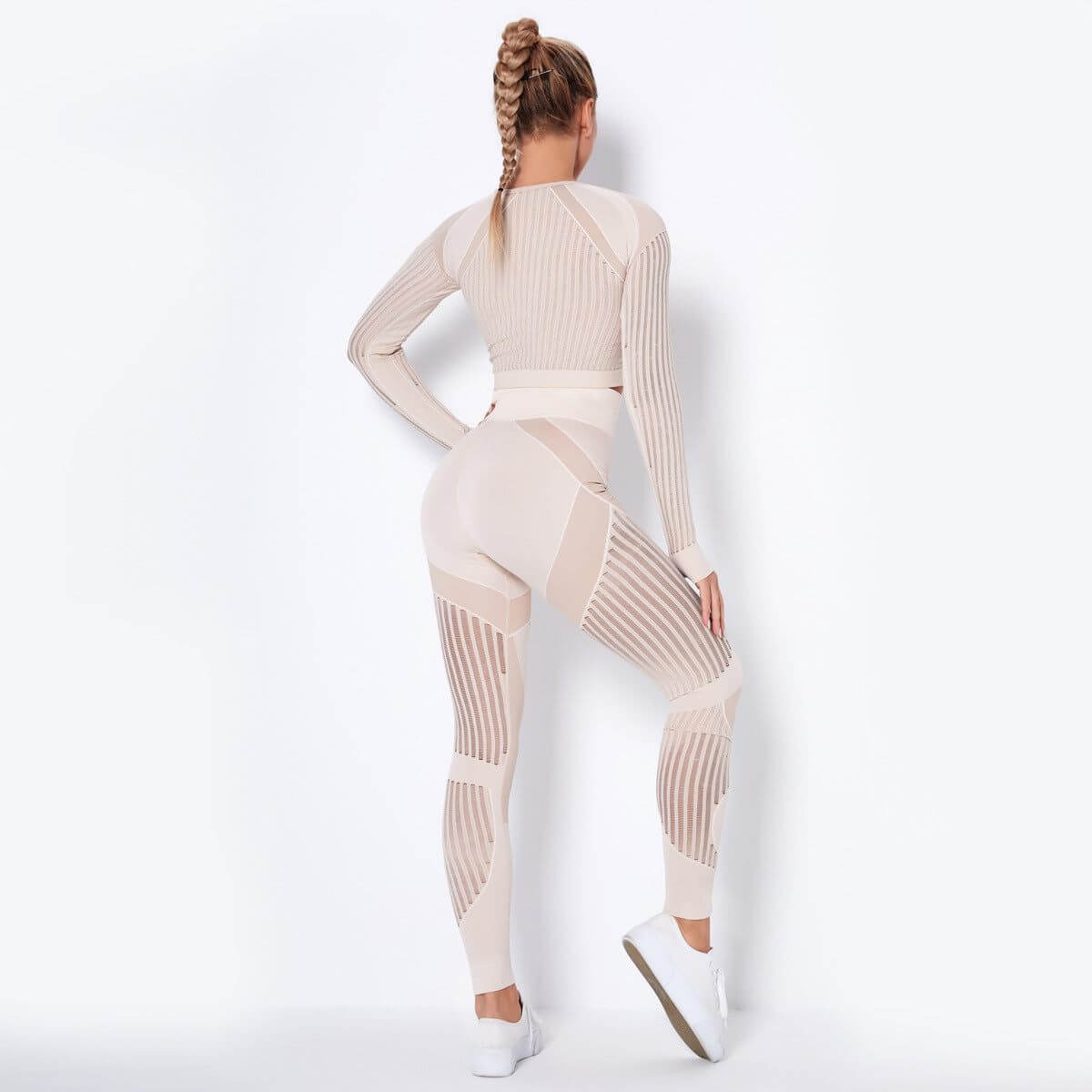 Seamless knitted absorbent yoga long-sleeved suit with stripe pattern, flexible and moisture-wicking fabric.