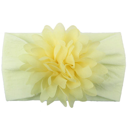 Yellow chiffon flower baby headband, perfect hair accessory for elegance.