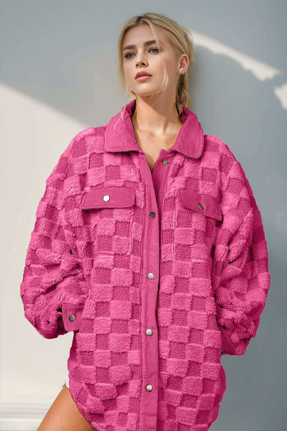 Fuzzy checkered shacket in vibrant pink with button-up closure and pockets.