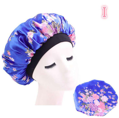 Beauty print Satin silk Bonnet sleep night cap with floral design in blue, polyester and spandex blend.