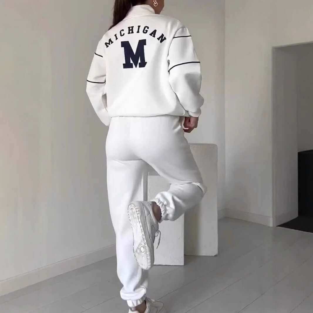 Women's fashion lounge hoodless pullover sweatsuit set with stylish stripes and pockets.