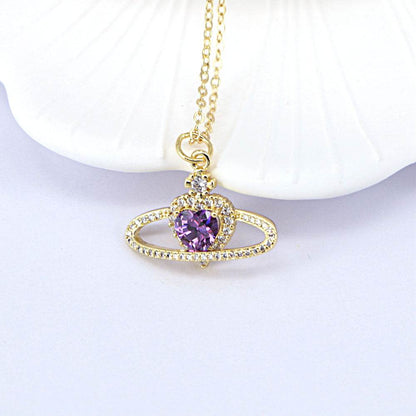 Ladies fashion zircon love necklace with purple heart pendant on a gold chain.