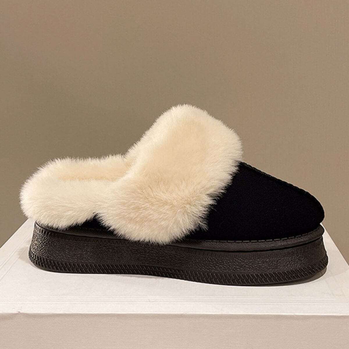 Suede soft round toe platform slippers with faux fur trim.