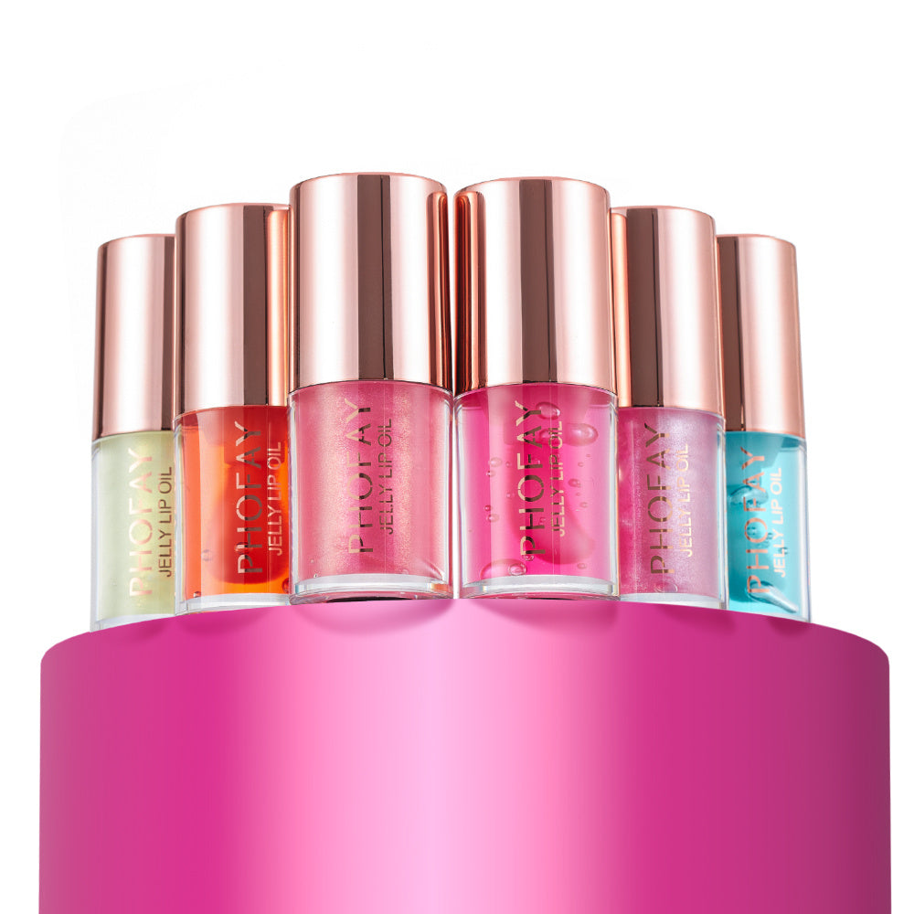 PHOFAY Jelly Lip Oil collection in assorted colors and rose gold caps on pink background.