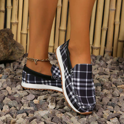 Plaid Round Toe Slip-Ons on rocky surface, showcasing comfort and style.