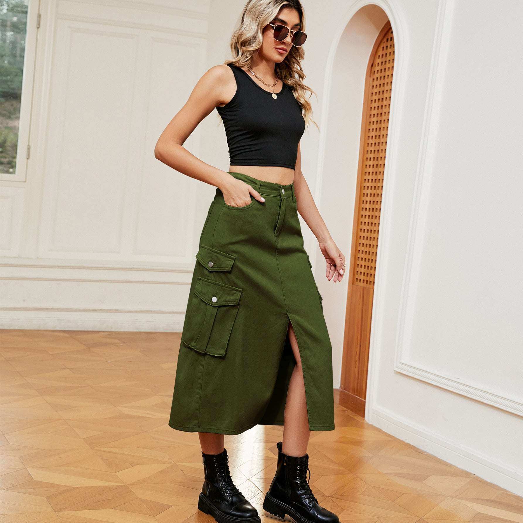 Women's denim cargo casual skirt in trendy green, styled with black top and boots.