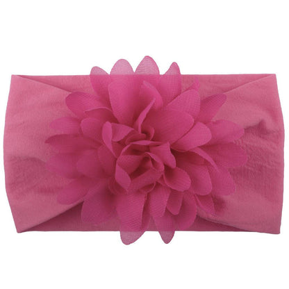 Pink chiffon flower baby headband hair accessory.