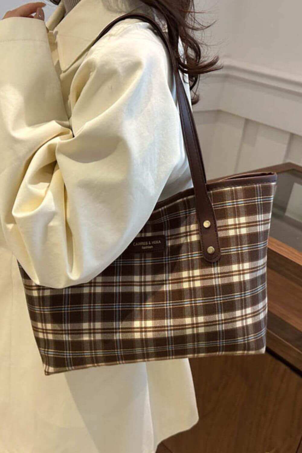 Plaid leather tote bag for women with plaid design.