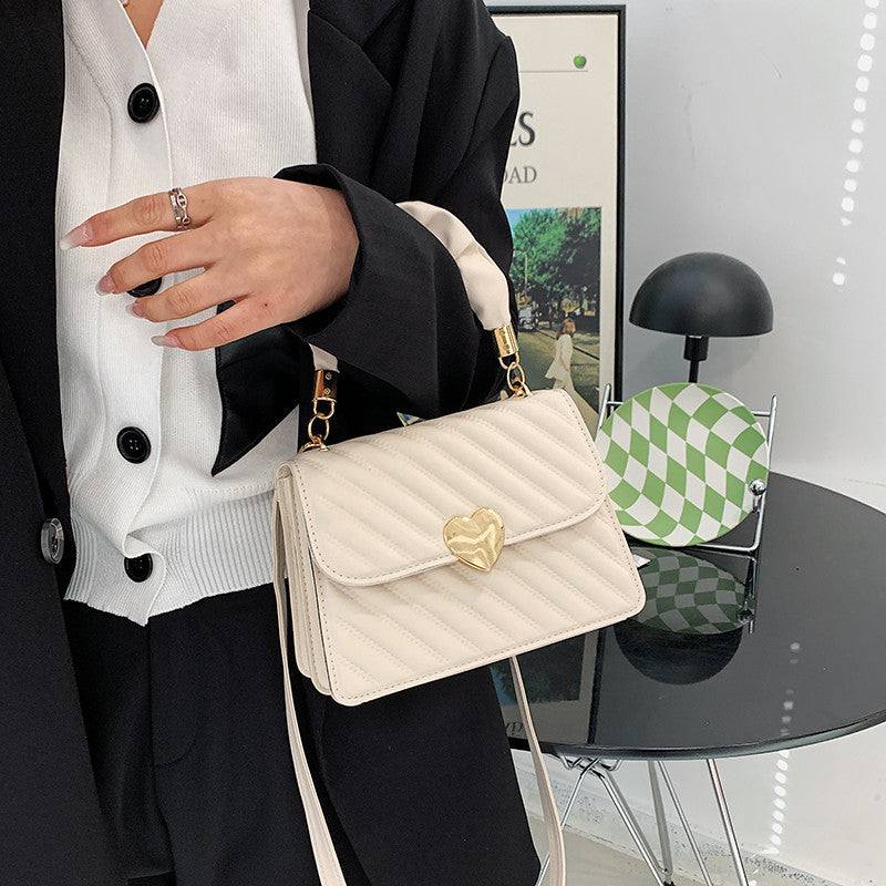 Women Handbags Fashion Chain Shoulder Bags With Love Metal DesignElevate your fashion game with our women handbags featuring a stylish chain and love metal design. Made with high-quality PU material, this small square bag is availHandbagsPlush Fashions ShopPlush Fashion Shop