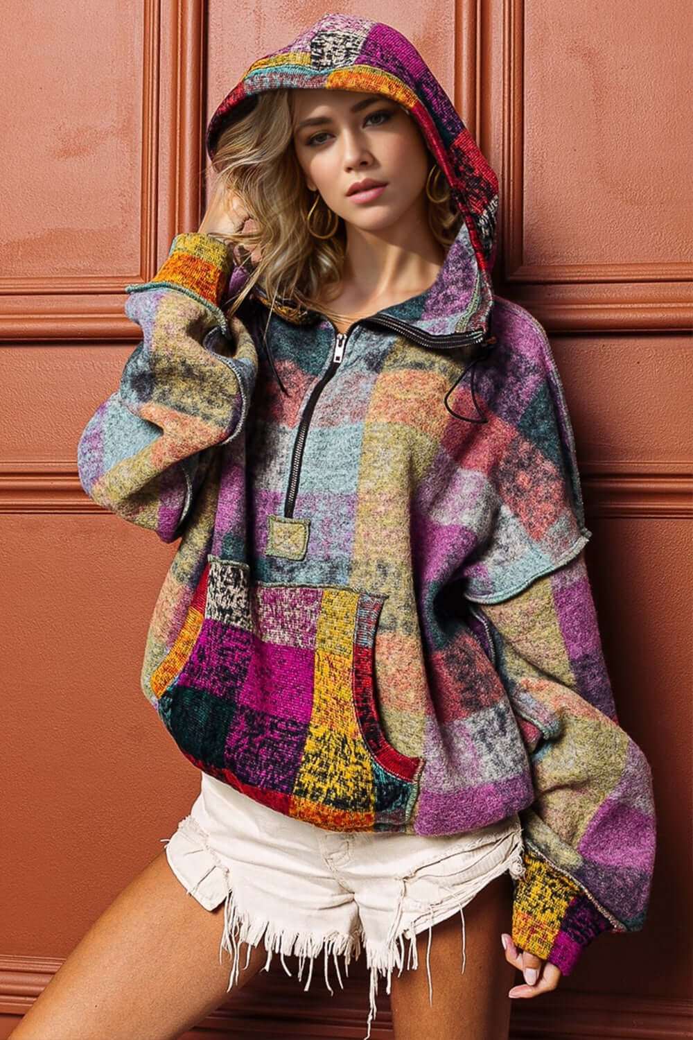 Full Size Half Zip Exposed Seam Fleece Hoodie in multicolor, featuring a patchwork design and front pocket.