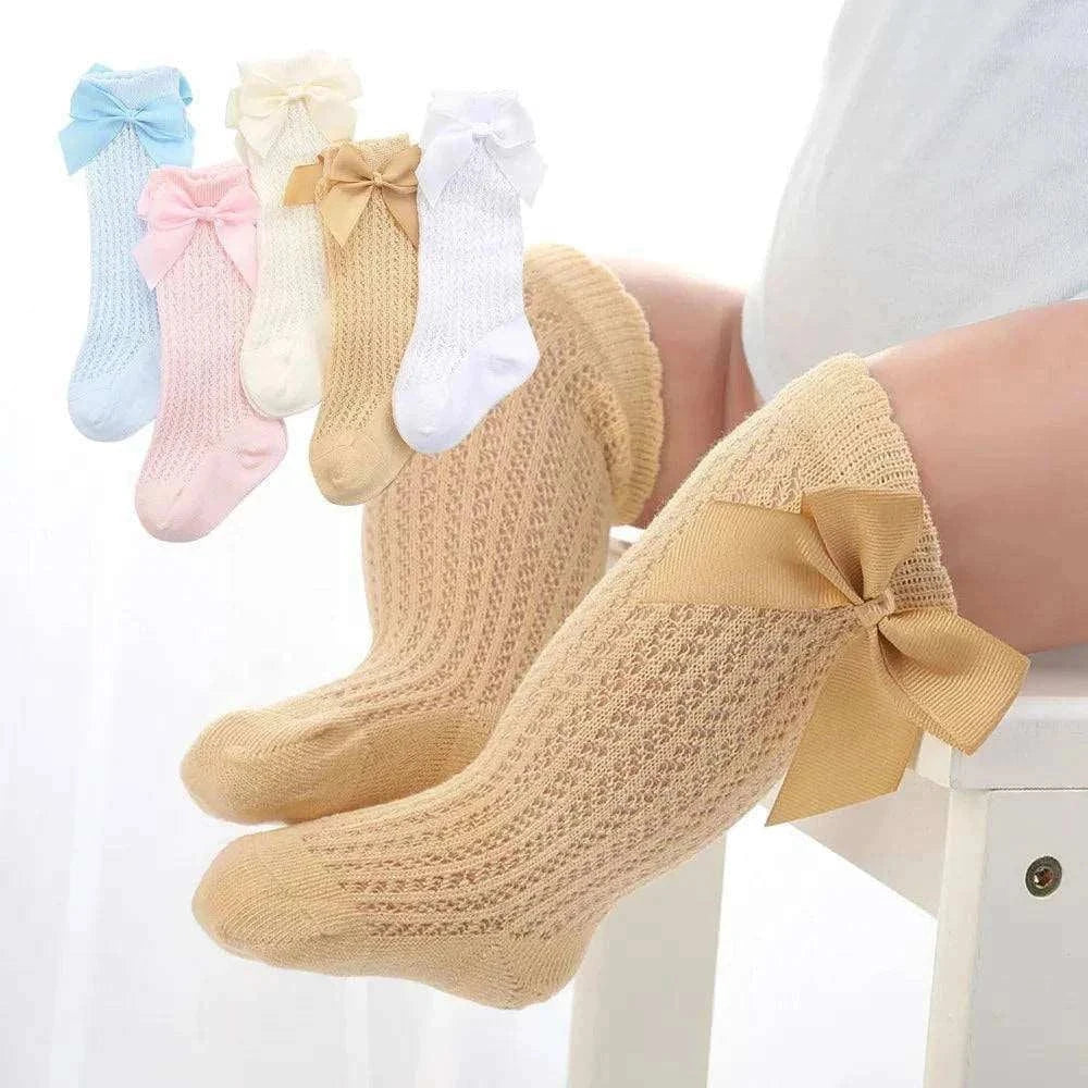 Baby Girls Long Bow Sock with lace detailing in various colors, knee-high design for 0-12 months.