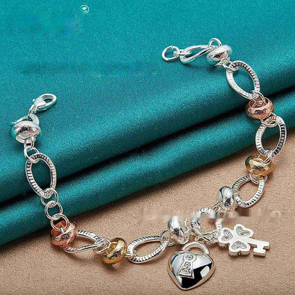 Silver Love Key Bracelet with retro ethnic design and love-shaped charm.