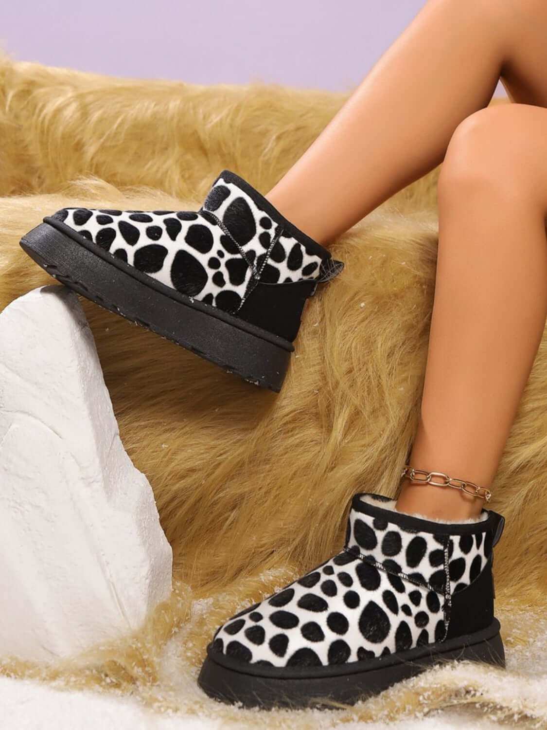 Thermal Animal Print Platform Boots with flats heel in black and white.