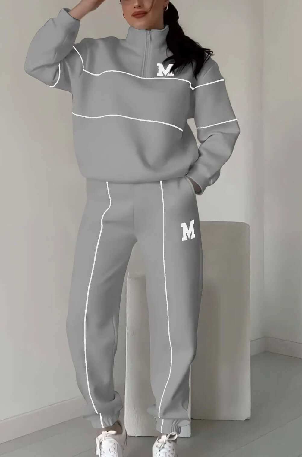 Women's fashion lounge hoodless pullover sweatsuit set with pockets in gray.