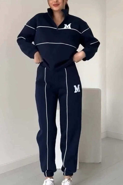 Women's fashion piece lounge hoodless pullover sweatsuit set with stylish stripes and pockets.