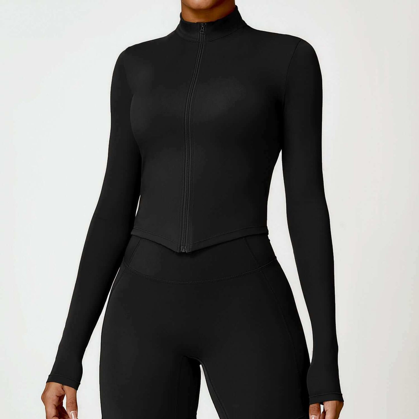 Women's tight long sleeve yoga wear in black, high-quality nylon fabric, available in various colors and sizes.