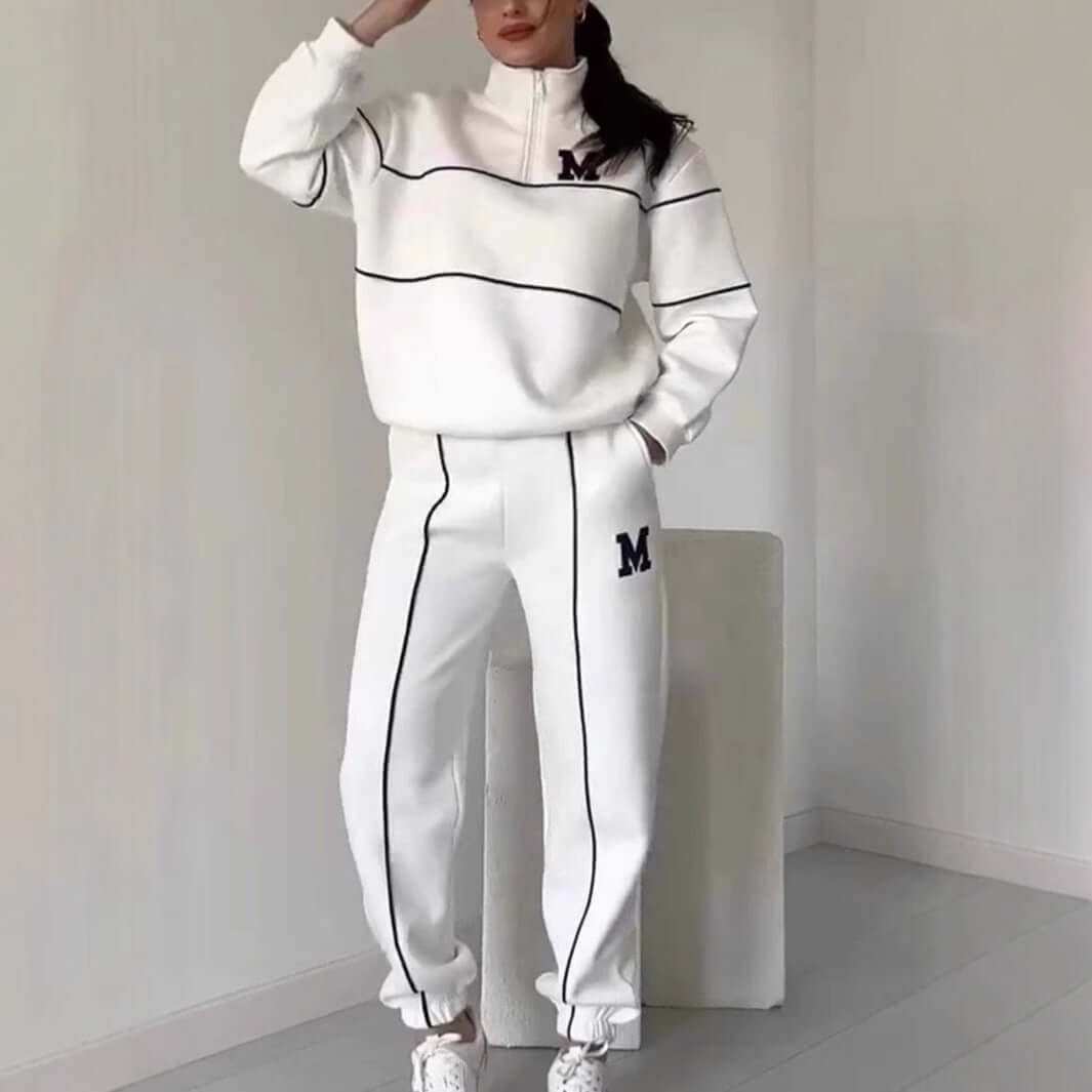 Women's hoodless pullover sweatsuit set with stylish stripes and pockets, perfect for lounging.