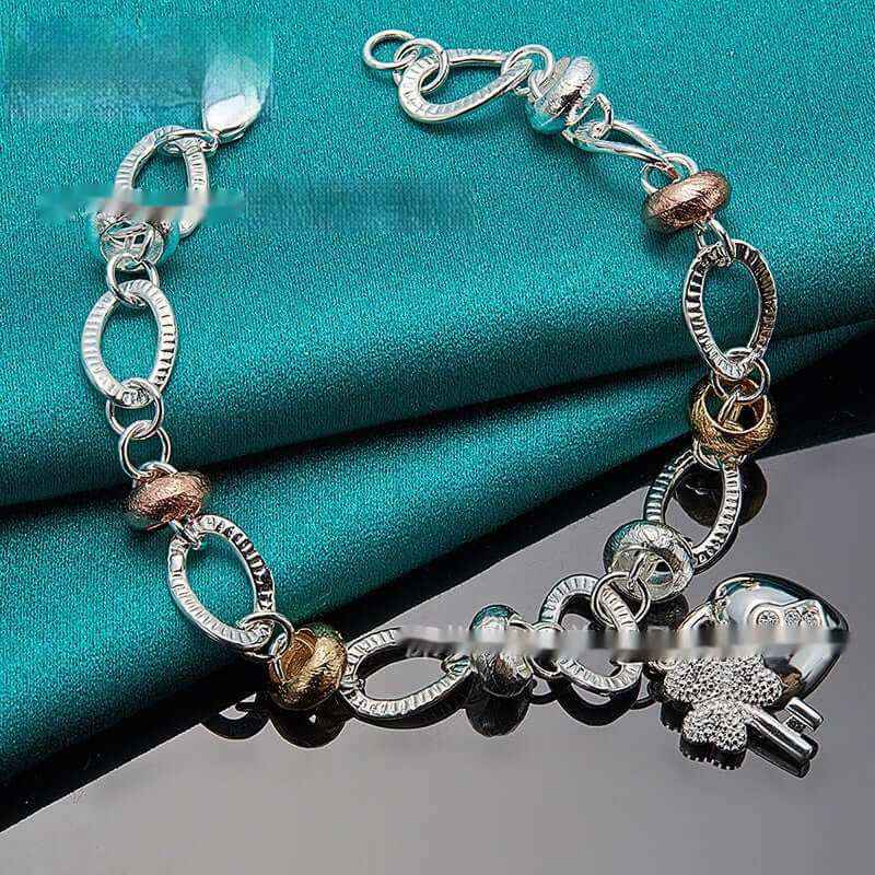 Silver Love Key Bracelet with retro ethnic design and romantic love-shaped charm.