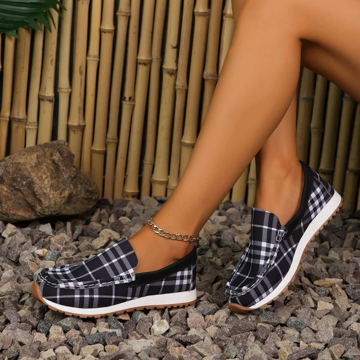 Plaid Round Toe Slip-Ons with durable elastomer and soft polyester, offering comfort and style.