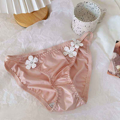 Silky low waist briefs with embroidered floral decorations, made from breathable milk silk fabric.