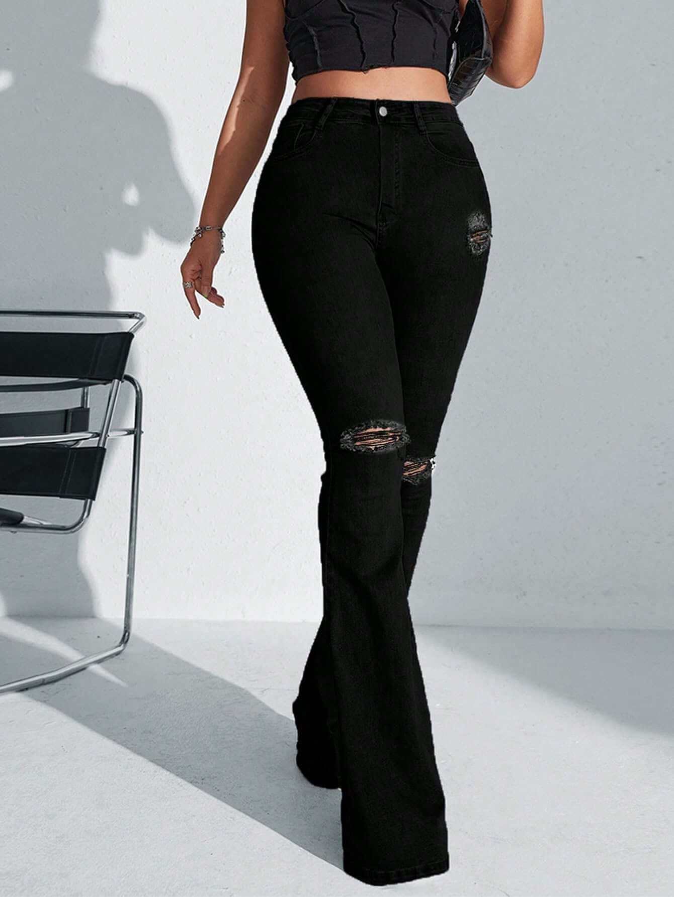 Ladies High Waist Ripped Flare Leg JeansElevate your denim game with our Ladies High Waist Ripped Flare Leg Jeans. Designed for the fashion-forward woman, these jeans make a statement with their black coloPantsPlush Fashions ShopPlush Fashion Shop