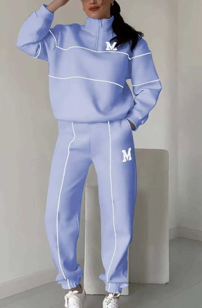 Women's fashion lounge hoodless pullover sweatsuit set with stylish stripes and pockets.