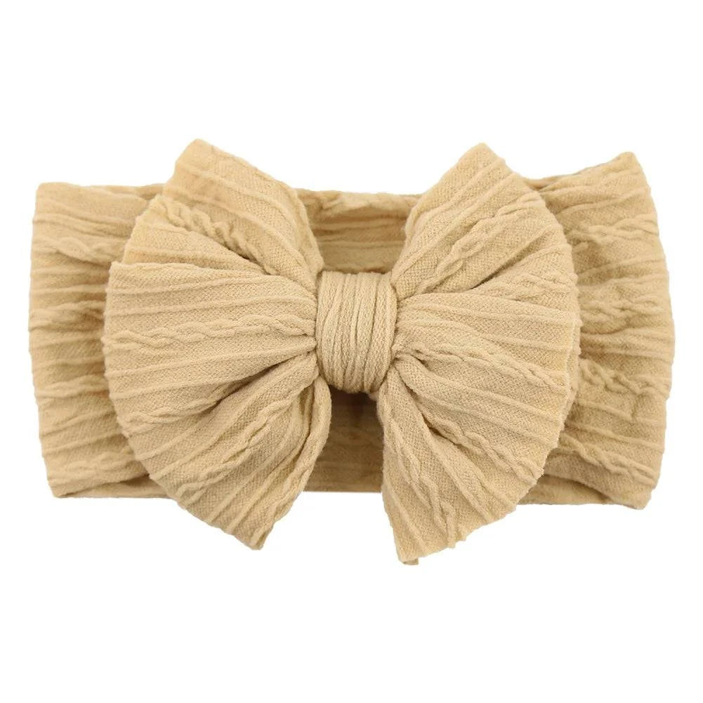 Newborn Solid Cable Baby Bow Headband for ChildEnhance any outfit with our Solid Cable Bow Baby Headband! Stretchy, soft Nylon material won't hurt your baby's head and will grow with them. Available in 20 colors,HairbowsPlush Fashions ShopPlush Fashion ShopNewborn Solid Cable Baby Bow Headband