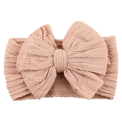 Newborn Solid Cable Baby Bow Headband for ChildEnhance any outfit with our Solid Cable Bow Baby Headband! Stretchy, soft Nylon material won't hurt your baby's head and will grow with them. Available in 20 colors,HairbowsPlush Fashions ShopPlush Fashion ShopNewborn Solid Cable Baby Bow Headband